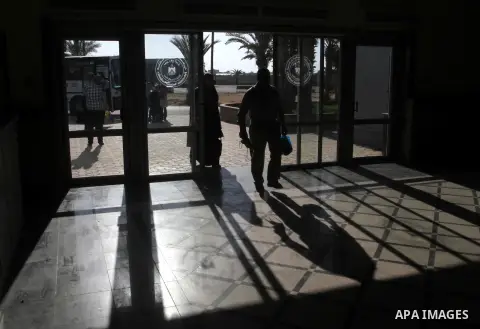 Families of Palestinian martyrs wait at the Rafah border crossing between Egypt and the southern Gaza Strip, on September 17, 2015, as they head to the annual hajj pilgrimage in Saudi Arabia's holy city of Mecca. Custodi...