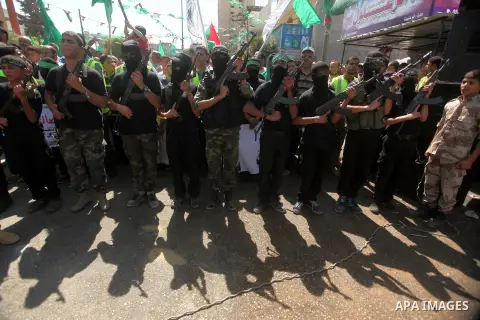 Palestinian Hamas militants take part in a protest against the Israeli police raid on Jerusalem's al-Aqsa mosque on Tuesday, in Khan Younis in the southern Gaza Strip, September 18, 2015. Israel deployed hundreds of extr...