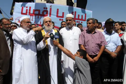 Palestinian Islamic Jihad supporters take part in a protest against the Israeli police raid on Jerusalem's al-Aqsa mosque on Tuesday, in Rafah in the southern Gaza Strip, September 18, 2015. Israel deployed hundreds of e...