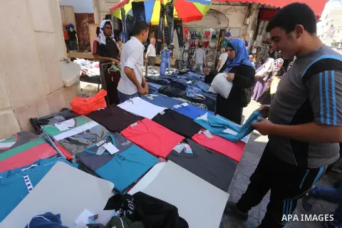 Palestinians shop in a market ahead of the major Muslim festival of Eid al-Adha holiday, in Gaza city, on Sept. 20, 2015. Eid al-Adha, or Feast of Sacrifice, commemorates what Muslims believe was Prophet Abraham's willin...