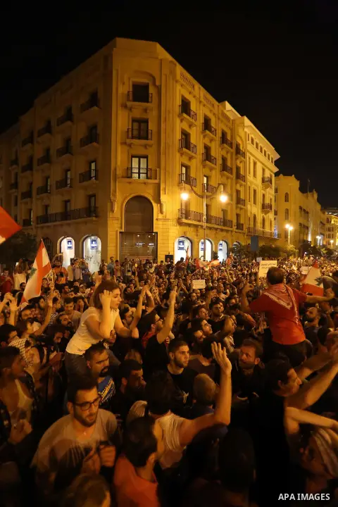 Protesters chant slogans and raise Lebanese national flags during a protest against perceived government failures, including a rubbish disposal crisis, in downtown Beirut, Lebanon September 20, 2015. Photo by Marwan Taht...