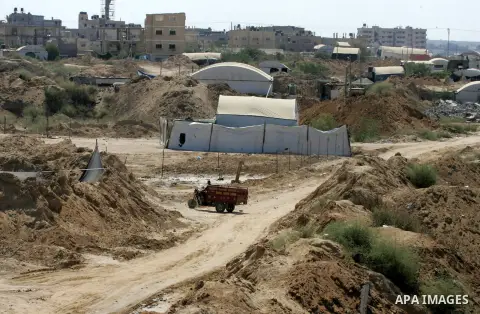 White tents shelter the entrances to tunnels are seen on the Gaza side after Egyptian forces flooded smuggling tunnels beneath the border to the Gaza strip, in Rafah, southern Gaza Strip, September 21, 2015. On Friday mo...