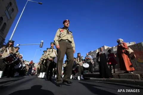 Palestinian scouts play musical instruments as they parade through the streets, celebrating the upcoming Eid al-Adha festival, in Jerusalem old city on September 21, 2015. Muslims across the world are preparing to celebr...