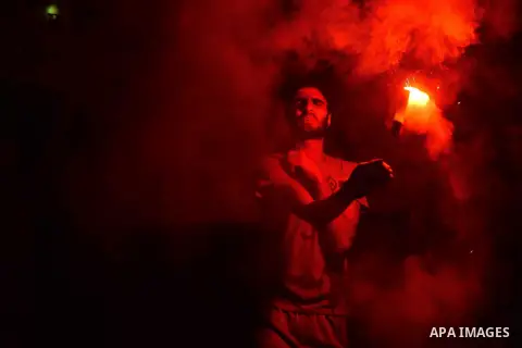Members of the Egyptian Ultras Nahdawi youth group light flares during a protest against the current Egyptian regime and against the Israeli restrictions at Jerusalem's flash-point Al-Aqsa mosque compound, in Kerdasa nei...