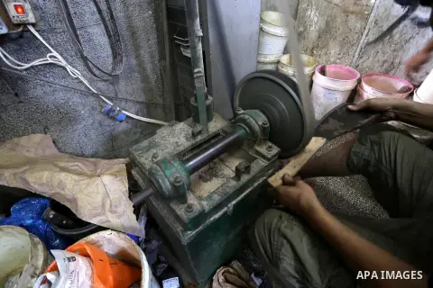 A Palestinian man sharpen knives at his workshop in Gaza city on Sept. 23, 2015. The knives use to slaughter cattle and sheep for the Muslim holiday of Eid al-Adha or the Feast of Sacrifice, which marks the end of the an...