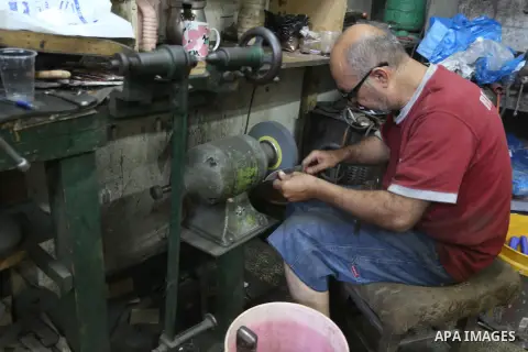 A Palestinian man sharpen knives at his workshop in Gaza city on Sept. 23, 2015. The knives use to slaughter cattle and sheep for the Muslim holiday of Eid al-Adha or the Feast of Sacrifice, which marks the end of the an...