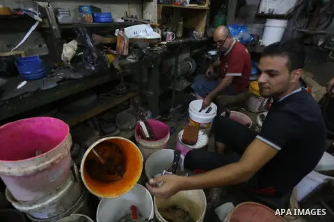 A Palestinian man sharpen knives at his workshop in Gaza city on Sept. 23, 2015. The knives use to slaughter cattle and sheep for the Muslim holiday of Eid al-Adha or the Feast of Sacrifice, which marks the end of the an...