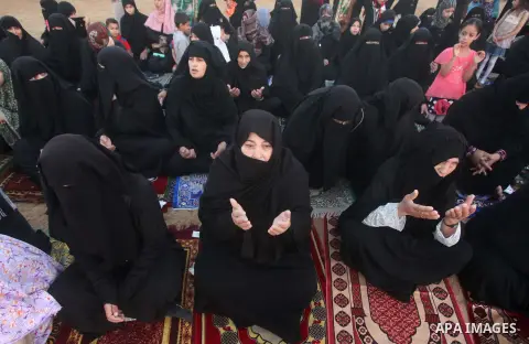 Palestinian muslims pray on the first day of of Eid al-Adha or the feast of sacrifice, in Khan Younis in the southern Gaza Strip on September 24, 2015. Muslims across the world are celebrating the annual festival of Eid...