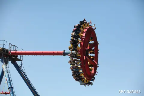 Palestinians play at an amusement park during the fourth day of Eid al-Adha or "Feast of the sacrifice" in Gaza City on September 27, 2015. Muslims across the world are celebrating the annual festival of Eid al-Adha whic...