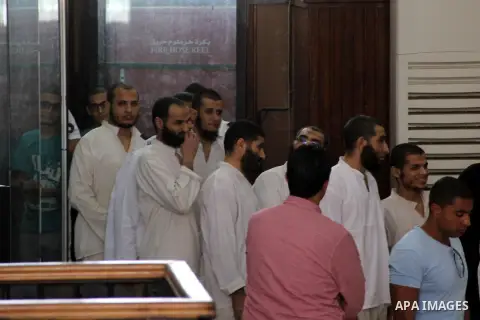 Suspects of Ansar Bait Al-Maqdis group, attend their trial in Cairo on September 29, 2015. 213 Suspects of Ansar Bait Al-Maqdis group, on charges of assassination of police officers, attempted assassination of interior m...