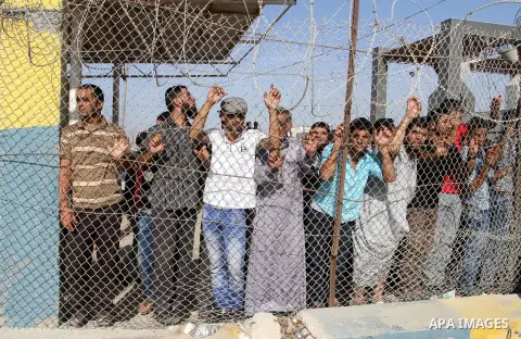 Palestinians wait for their pilgrim relatives at the Rafah crossing between Gaza Strip and Egypt after performing the annual Hajj, in Rafah in southern Gaza Strip, September 30, 2015. Around 500 Hajj pilgrims cross Rafah...