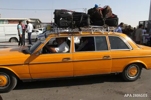 Palestinian pilgrims arrive at the Rafah crossing between Gaza Strip and Egypt after performing the annual Hajj, in Rafah in southern Gaza Strip, September 30, 2015. Around 500 Hajj pilgrims cross Rafah crossing on Wedne...