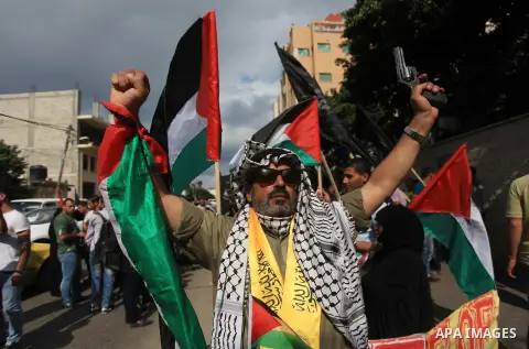 Relatives of Palestinian prisoners in Israeli jails, take part in a protest to show solidarity with Palestinians clashing with Israeli security forces at Jerusalem's al-Aqsa mosque, outside the Red Cross office, in Gaza...