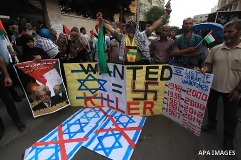 Relatives of Palestinian prisoners in Israeli jails, take part in a protest to show solidarity with Palestinians clashing with Israeli security forces at Jerusalem's al-Aqsa mosque, outside the Red Cross office, in Gaza...