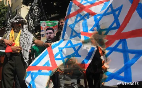 Relatives of Palestinian prisoners in Israeli jails, take part in a protest to show solidarity with Palestinians clashing with Israeli security forces at Jerusalem's al-Aqsa mosque, outside the Red Cross office, in Gaza...