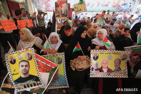 Relatives of Palestinian prisoners in Israeli jails, take part in a protest to show solidarity with Palestinians clashing with Israeli security forces at Jerusalem's al-Aqsa mosque, outside the Red Cross office, in Gaza...