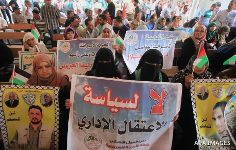 Relatives of Palestinian prisoners in Israeli jails, take part in a protest to show solidarity with Palestinians clashing with Israeli security forces at Jerusalem's al-Aqsa mosque, outside the Red Cross office, in Gaza...