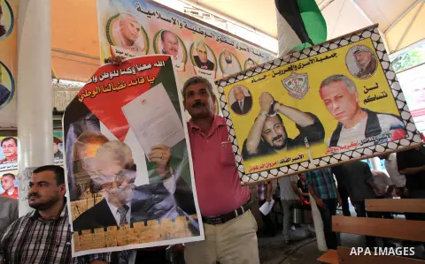 Relatives of Palestinian prisoners in Israeli jails, take part in a protest to show solidarity with Palestinians clashing with Israeli security forces at Jerusalem's al-Aqsa mosque, outside the Red Cross office, in Gaza...