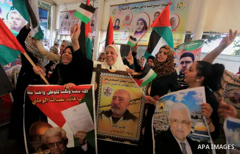 Relatives of Palestinian prisoners in Israeli jails, take part in a protest to show solidarity with Palestinians clashing with Israeli security forces at Jerusalem's al-Aqsa mosque, outside the Red Cross office, in Gaza...