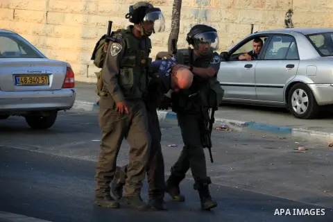 Israeli police help a wounded fellow during clashes with Palestinian protesters in Shuafat, an Arab suburb of Jerusalem October 5, 2015. A Palestinian teenager was killed on Monday in a clash with Israeli soldiers near t...