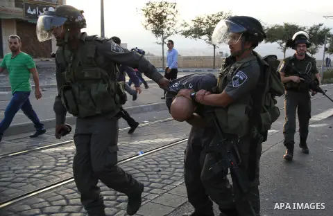 Israeli police arrest a Palestinian protester during clashes in Shuafat, an Arab suburb of Jerusalem October 5, 2015. A Palestinian teenager was killed on Monday in a clash with Israeli soldiers near the West Bank town o...