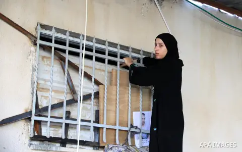 A Palestinian woman inspects the home of the Ghassan Abu Jamal that was demolished by the Israeli military in the Jabal Mukaber neighborhood, in east Jerusalem, October 6, 2015. The Israeli military on Tuesday demolished...