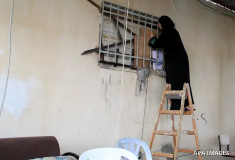 A Palestinian woman inspects the home of the Ghassan Abu Jamal that was demolished by the Israeli military in the Jabal Mukaber neighborhood, in east Jerusalem, October 6, 2015. The Israeli military on Tuesday demolished...