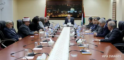 Palestinian Prime Minister, Rami Hamdallah chairs a meeting of the council of ministers, in the West Bank city of Ramallah, on October 8, 2015. Photo by Prime Minister Office