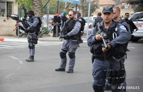 Israeli policemen secure the area where a Palestinian stabbed two Israeli Jews before he was shot dead outside Jerusalem's Old City October 10, 2015. Israeli forces shot dead two Palestinian assailants in East Jerusalem...