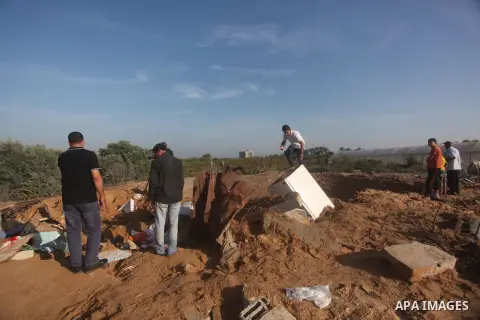 Palestinians inspect the damage after an Israeli retaliatory air strike demolished the house of a Palestinian family on October 11, 2015 in the Zeitun sector south of Gaza City. A pregnant Palestinian mother and her todd...