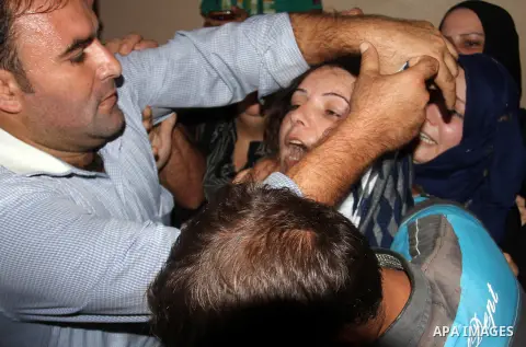 Relatives of Palestinian boy Marwan Barbakh, 12, who was shot dead by Israeli forces on Saturday, mourn during his funeral in Khan Younis in the southern Gaza Strip October 11, 2015. Israeli security forces on Saturday s...