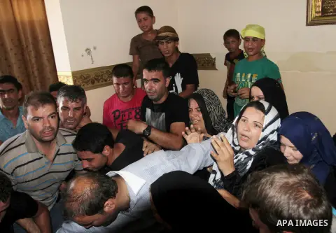 Relatives of Palestinian boy Marwan Barbakh, 12, who was shot dead by Israeli forces on Saturday, mourn during his funeral in Khan Younis in the southern Gaza Strip October 11, 2015. Israeli security forces on Saturday s...