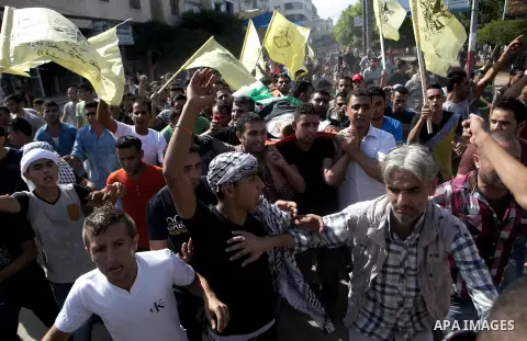 Mourners carry the body of Palestinian boy Marwan Barbakh, 12, who was shot dead by Israeli forces on Saturday, during his funeral in Khan Younis in the southern Gaza Strip October 11, 2015. Israeli security forces on Sa...