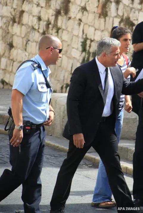 Israeli MP and chairperson of the center-right Yesh Atid party, Yair Lapid, visits the Lion Gate in Jerusalem's Old City on October 12, 2015, as he visits Israeli security forces at the location following days of tension...