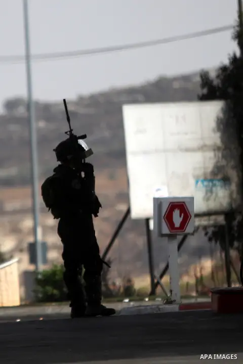 Israeli border guards keep position during clashes with Palestinian protesters in Beit El on the outskirts of the West Bank city of Ramallah, on October 12, 2015. Three new stabbings in Jerusalem and a car attack spread...