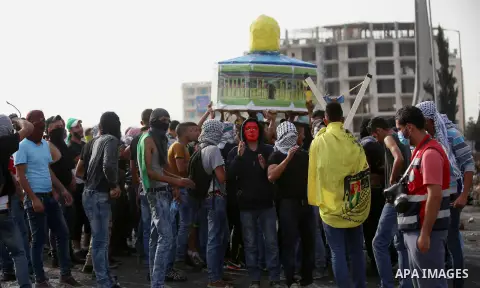 Palestinian protesters clash with Israeli security forces in Beit El on the outskirts of the West Bank city of Ramallah, on October 12, 2015. Three new stabbings in Jerusalem and a car attack spread more fear among Israe...