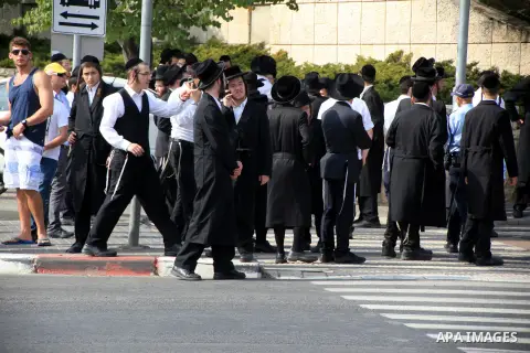 Ultra-Orthodox Jews watch survey the scene of a stabbing in Jerusalem October 12, 2015. Palestinians escalated the pace of stabbing attacks in the Jerusalem area on Monday and Israeli police shot dead two of the alleged...