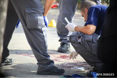 Israeli police officers survey the scene of a stabbing in Jerusalem October 12, 2015. Palestinians escalated the pace of stabbing attacks in the Jerusalem area on Monday and Israeli police shot dead two of the alleged as...