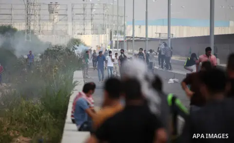 Palestinian protesters clash with Israeli security forces next to the border fence with Israel, at the Erez crossing in the northern Gaza strip, on October 13, 2015. A wave of stabbings that hit Israel, Jerusalem and the...