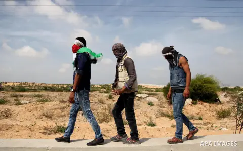 Palestinian protesters clash with Israeli security forces next to the border fence with Israel, at the Erez crossing in the northern Gaza strip, on October 13, 2015. A wave of stabbings that hit Israel, Jerusalem and the...
