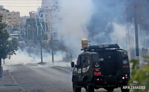 Palestinian protesters throw stones at Israeli security forces during clashes in the West Bank city of Bethlehem, on October 13, 2015. A wave of stabbings that hit Israel, Jerusalem and the West Bank this month along wit...