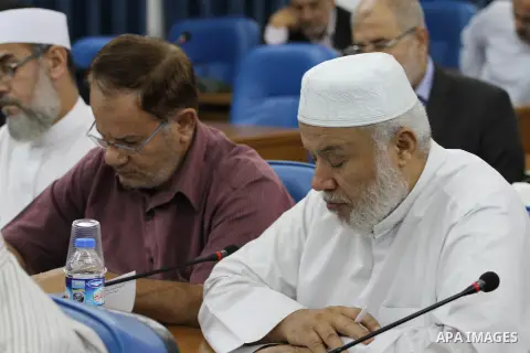 Members of the Palestinian legislative council from Hamas movement attend a meeting at the legislative council in Gaza city on Oct. 14, 2015. Photo by Mohammed Asad