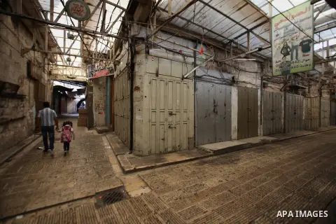 A general view shows closed shops at a market in the West Bank city of Nablus during a general strike in solidarity with the ongoing clashes surrounding access to Jerusalem's Al-Aqsa mosque compound on October 14, 2015....