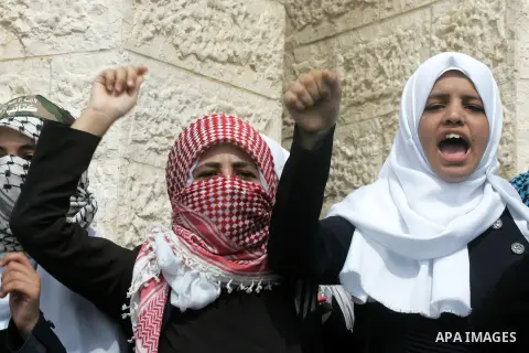 Palestinian schoolgirls shout slogans during an anti-Israel protest in the southern Gaza Strip town of Rafah on October 14, 2015. Amid violent protests and a wave of stabbings spreading fear in Israel and warnings that a...