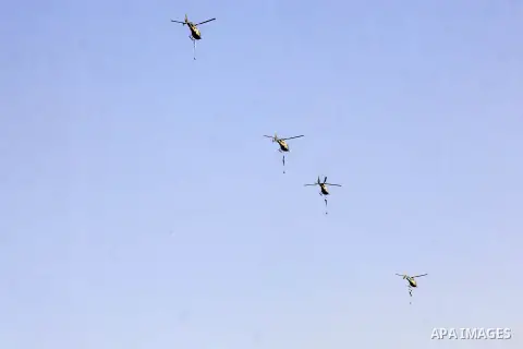 Egyptian air force planes participate in an air parade during a celebration marking the airforce day, in Cairo on October 14, 2015. Photo by Stringer