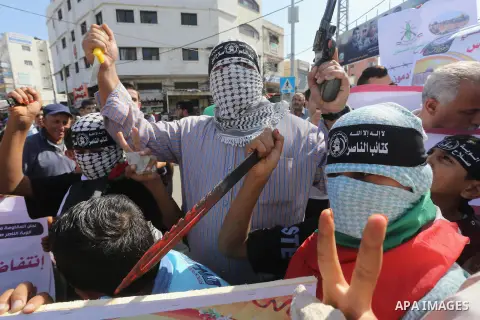 Palestinians shout slogans during an anti-Israel protest in Gaza city, on October 15, 2015. Amid violent protests and a wave of stabbings spreading fear in Israel and warnings that a full-scale uprising could erupt, a ne...