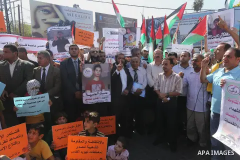 Palestinians shout slogans during an anti-Israel protest in Gaza city, on October 15, 2015. Amid violent protests and a wave of stabbings spreading fear in Israel and warnings that a full-scale uprising could erupt, a ne...