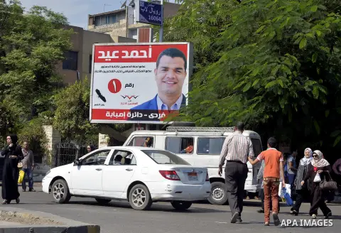 A general view shows portraits of candidates for the upcoming parliamentary elections, hanging in Cairo, on October 15, 2015. Egyptians begin voting on the weekend for a parliament expected to step firmly in line behind...