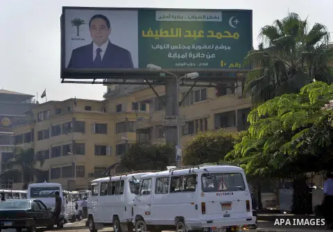 A general view shows portraits of candidates for the upcoming parliamentary elections, hanging in Cairo, on October 15, 2015. Egyptians begin voting on the weekend for a parliament expected to step firmly in line behind...