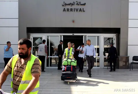 Palestinians arrive at the Rafah border crossing at the southern Gaza Strip October 15, 2015. Egypt opened the Rafah border crossing on Thursday for one day to allow stranded Palestinians to return to the Gaza Strip, off...